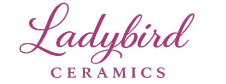 Logo of Ladybird Ceramics with a pink cursive font on a white background